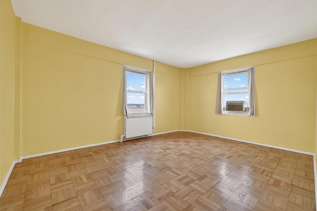 6 Fordham Hill Oval Unit 14B, Bronx, NY 10468 - empty room featuring healthy amount of natural light, radiator heating unit, and cooling unit