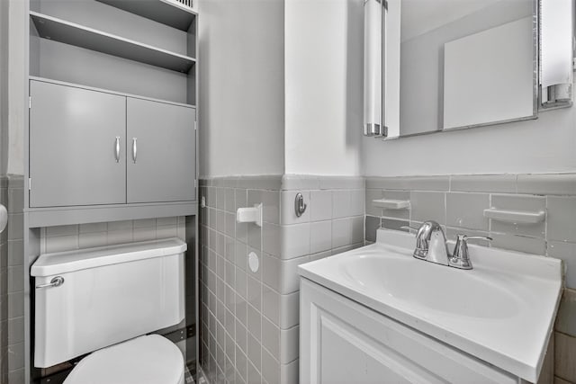 6 Fordham Hill Oval Unit 14B, Bronx, NY 10468 - half bathroom with tile walls, vanity, and a wainscoted wall