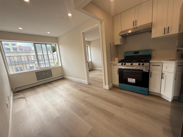 3113 137th St, Flushing, NY 11354 - kitchen featuring gas range oven, under cabinet range hood, a baseboard heating unit, white cabinets, and recessed lighting