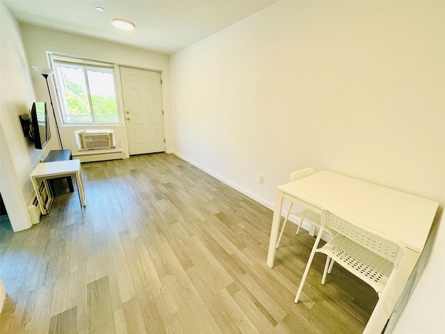 3113 137th St, Flushing, NY 11354 - entryway with light wood-style floors and a wall unit AC