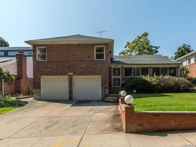 222-60 Birmington Pkwy, Bayside, NY 11364 - tri-level home with concrete driveway, brick siding, an attached garage, and a front yard