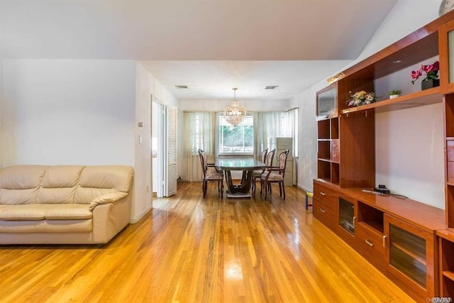 222-60 Birmington Pkwy, Bayside, NY 11364 - dining space featuring light wood-style flooring and a chandelier