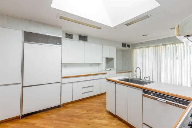 222-60 Birmington Pkwy, Bayside, NY 11364 - kitchen featuring paneled refrigerator, dishwasher, white cabinets, and light countertops