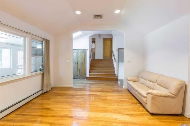 222-60 Birmington Pkwy, Bayside, NY 11364 - corridor featuring a baseboard heating unit, light wood-style floors, vaulted ceiling, recessed lighting, and stairway