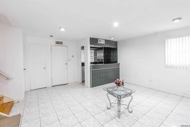 222-60 Birmington Pkwy, Bayside, NY 11364 - unfurnished living room featuring stairway and recessed lighting