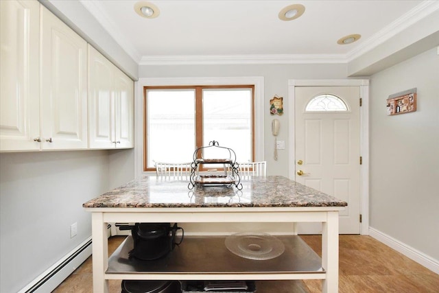 36 Shubert Ln, Bethpage, NY 11714 - kitchen with stone countertops, a baseboard radiator, white cabinetry, and crown molding