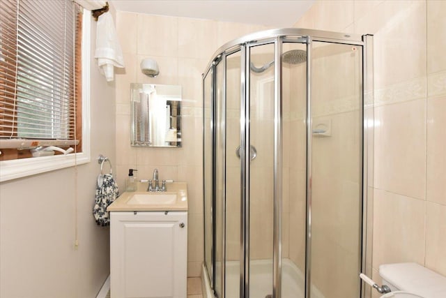 36 Shubert Ln, Bethpage, NY 11714 - bathroom with vanity, tile walls, and a stall shower