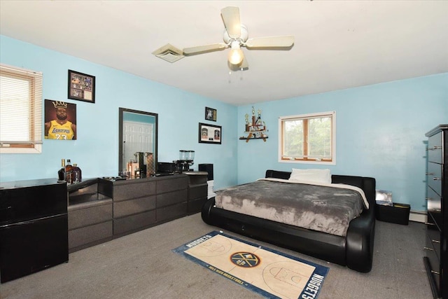 36 Shubert Ln, Bethpage, NY 11714 - bedroom with carpet flooring, a baseboard heating unit, and a ceiling fan
