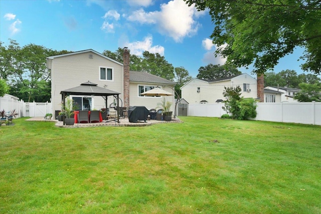 36 Shubert Ln, Bethpage, NY 11714 - rear view of property featuring a gazebo, a patio area, a chimney, and a fenced backyard