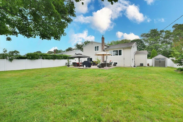 36 Shubert Ln, Bethpage, NY 11714 - back of property featuring a gazebo, a shed, a patio, and a chimney