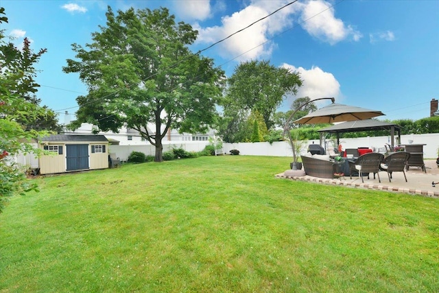 36 Shubert Ln, Bethpage, NY 11714 - fenced backyard with an outdoor living space, a shed, a patio, and a gazebo