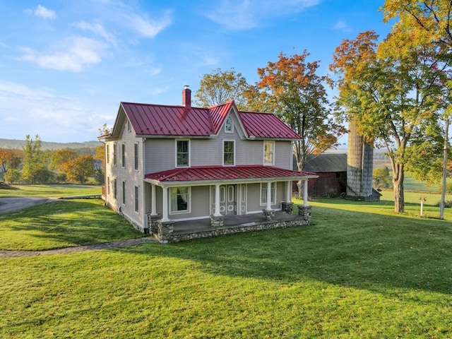 247 Sarah Wells Trl, Campbell Hall, NY 10916 - farmhouse featuring a standing seam roof, a chimney, a metal roof, and a front yard