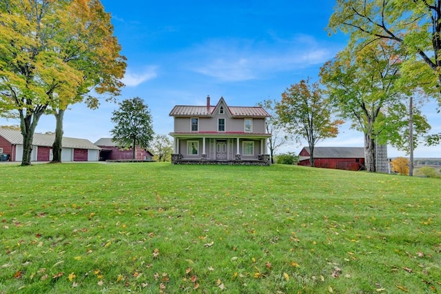 247 Sarah Wells Trl, Campbell Hall, NY 10916 - rear view of house with a porch, a lawn, a metal roof, and a chimney
