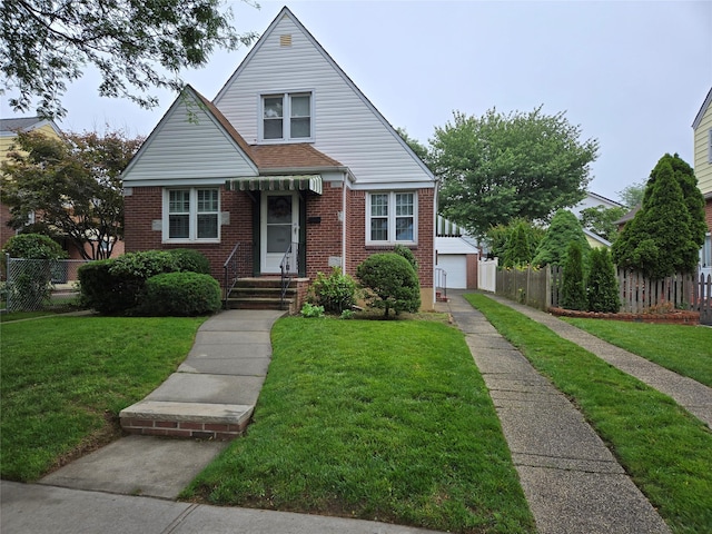 8251 257th St, Glen Oaks, NY 11004 - bungalow with brick siding, a detached garage, and an outdoor structure