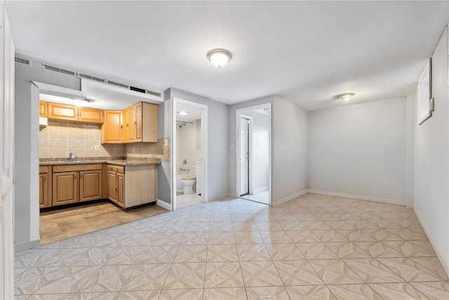 2801 Gunther Ave, Bronx, NY 10469 - kitchen featuring backsplash and baseboards
