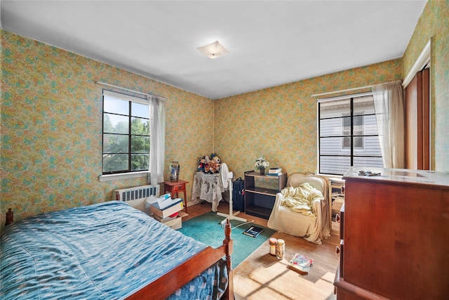 98 Pell Pl, Bronx, NY 10464 - bedroom featuring wood finished floors and radiator heating unit