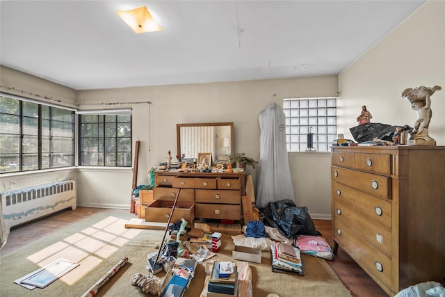 98 Pell Pl, Bronx, NY 10464 - bedroom featuring radiator heating unit and wood finished floors