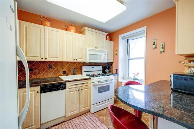 370 Westchester Unit 3N, Port Chester, NY 10573 - kitchen featuring white appliances, dark countertops, and decorative backsplash