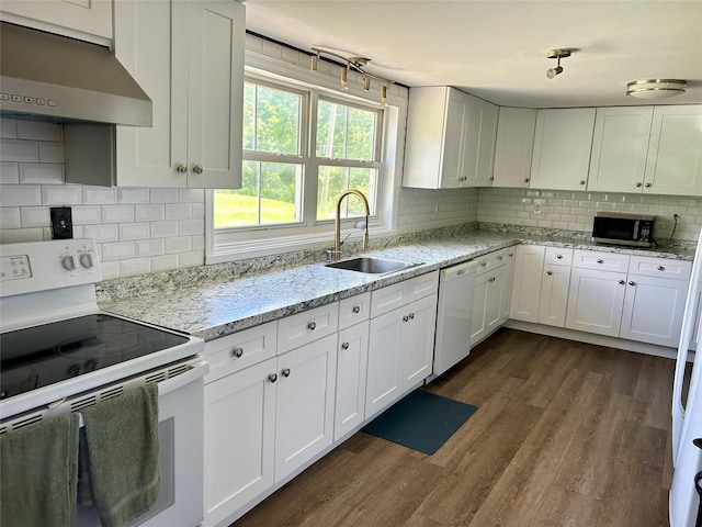16 Rte 292 Unit 14, Patterson, NY 12563 - kitchen with white appliances, extractor fan, white cabinetry, dark wood-type flooring, and backsplash