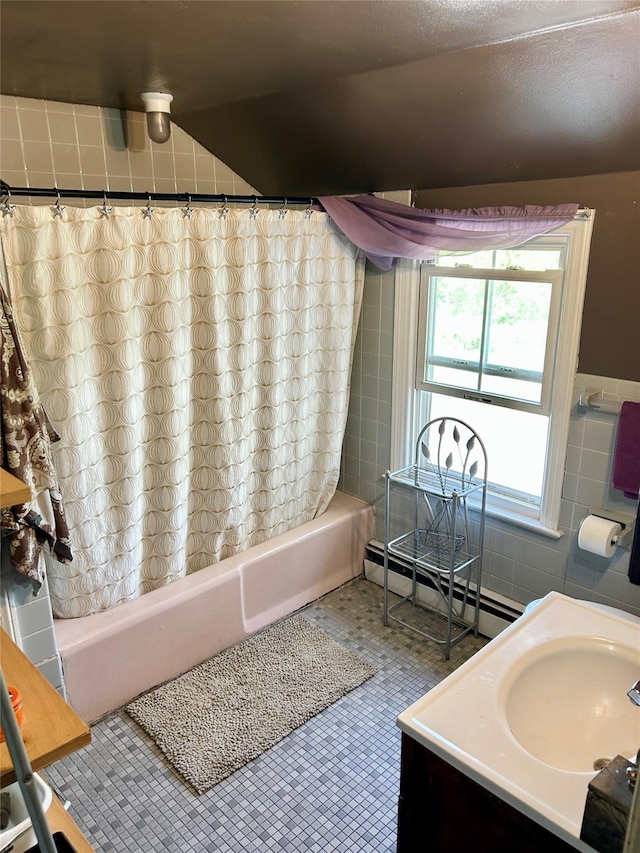 16 Rte 292 Unit 14, Patterson, NY 12563 - bathroom with baseboard heating, shower / tub combo with curtain, vanity, tile walls, and tile patterned floors