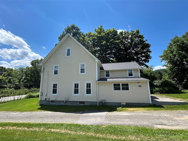 16 Rte 292 Unit 14, Patterson, NY 12563 - rear view of property with a lawn and a shingled roof