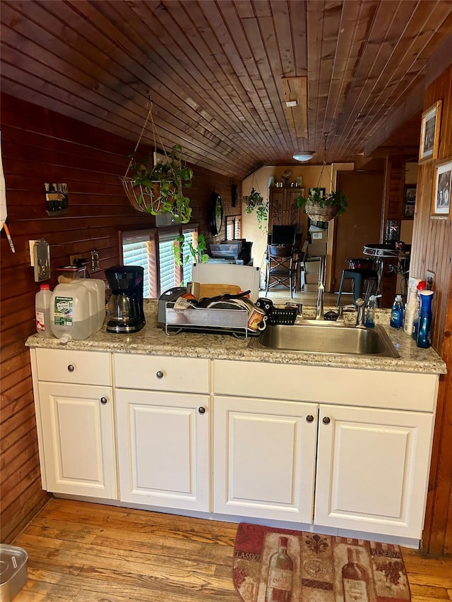 16 Rte 292 Unit 14, Patterson, NY 12563 - kitchen featuring wooden walls, white cabinetry, wooden ceiling, and light wood-style floors
