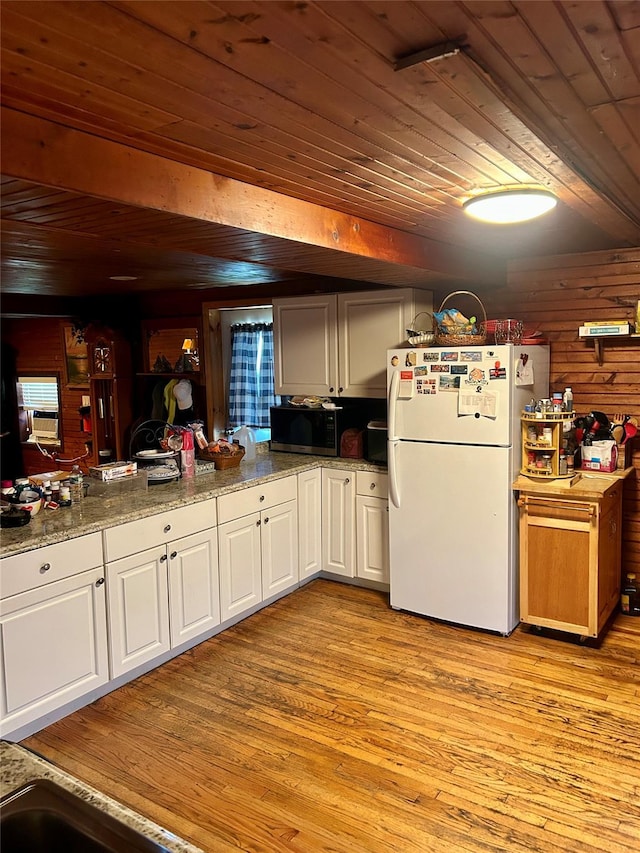 16 Rte 292 Unit 14, Patterson, NY 12563 - kitchen with freestanding refrigerator, wood ceiling, stainless steel microwave, light wood finished floors, and white cabinetry