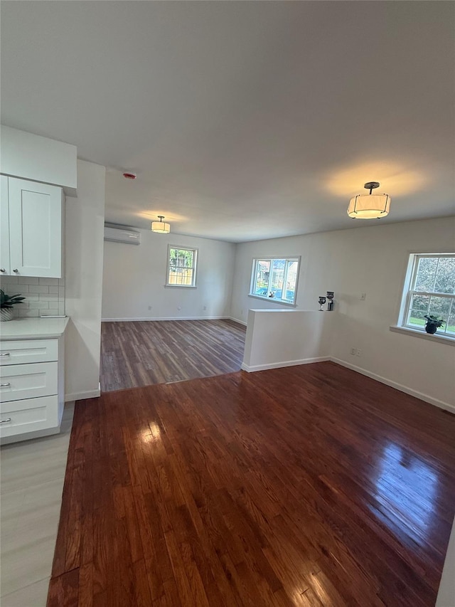 22 Hulse St, Wallkill, NY 12589 - unfurnished living room with light wood finished floors and plenty of natural light