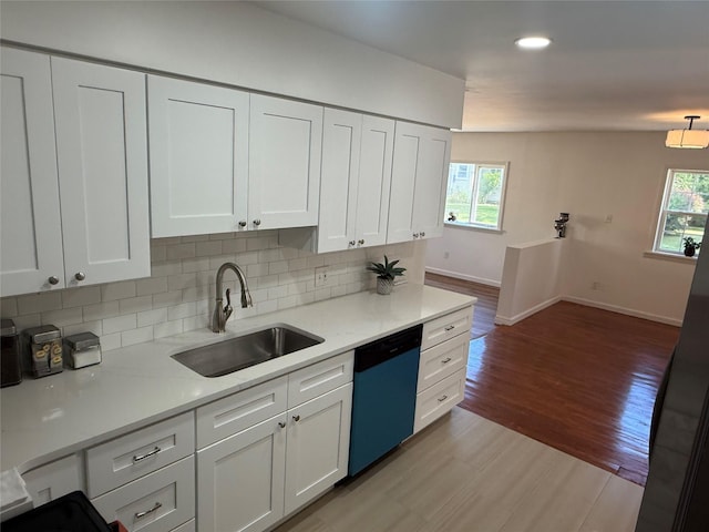 22 Hulse St, Wallkill, NY 12589 - kitchen featuring dishwashing machine, white cabinetry, tasteful backsplash, light countertops, and recessed lighting
