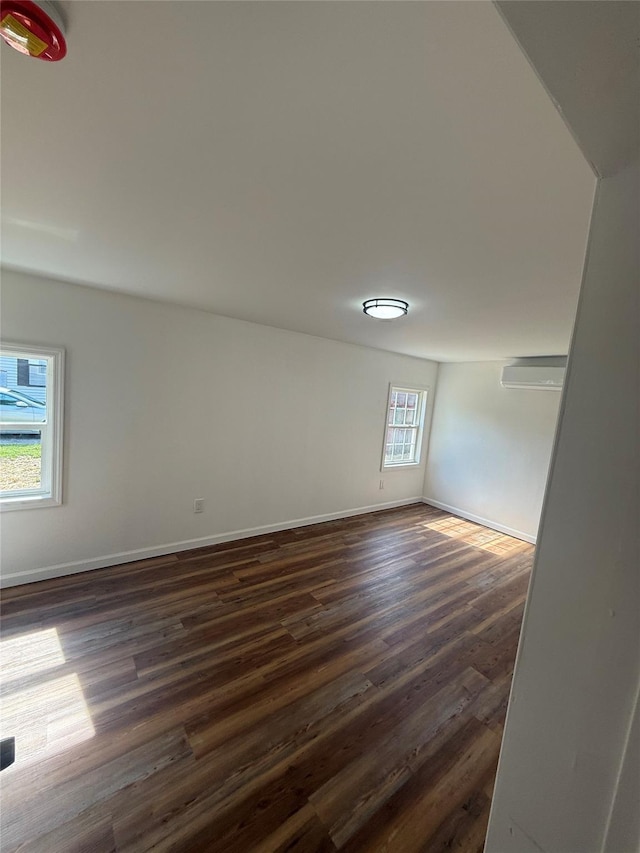 22 Hulse St, Wallkill, NY 12589 - spare room featuring dark wood-style flooring and a wall mounted AC