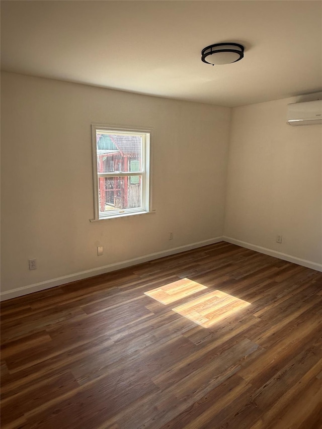 22 Hulse St, Wallkill, NY 12589 - spare room featuring a wall mounted air conditioner and dark wood-type flooring