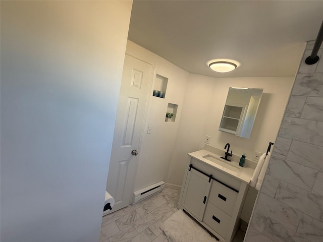 22 Hulse St, Wallkill, NY 12589 - bathroom with marble look tiles, baseboard heating, and vanity