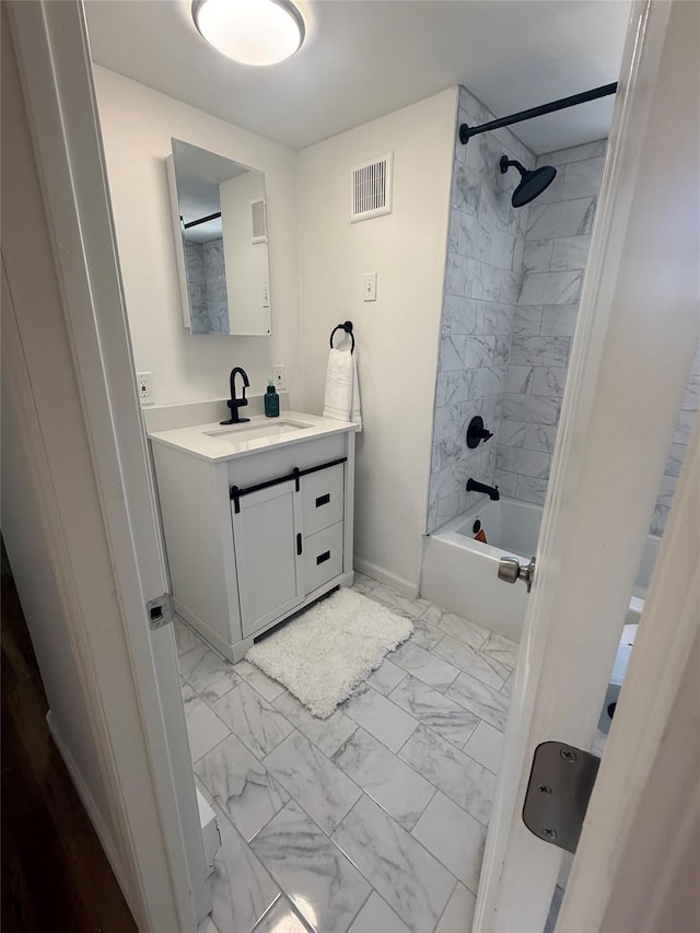 22 Hulse St, Wallkill, NY 12589 - full bathroom with marble look tiles, vanity, and bathing tub / shower combination