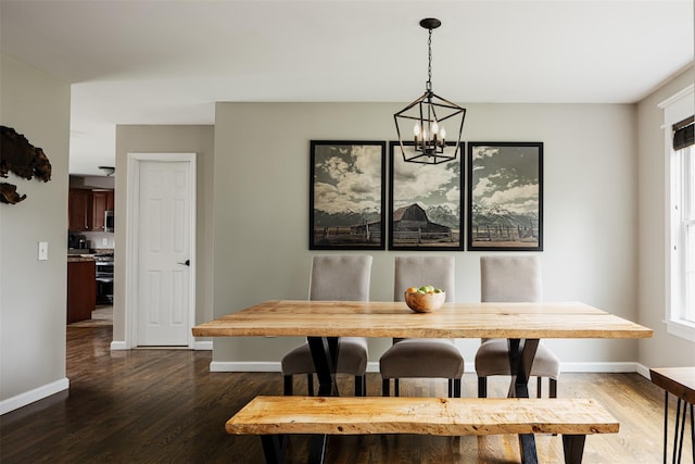 6 Danamarie Ln, East Patchogue, NY 11772 - dining room featuring dark wood finished floors and a chandelier
