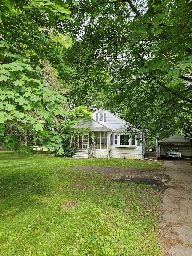7679 Albany Post Rd, Red Hook, NY 12571 - view of front of property with entry steps, a front lawn, a detached carport, and driveway