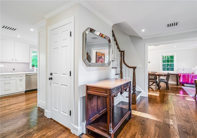 30 Hilltop Rd, Waccabuc, NY 10597 - corridor featuring stairway, dark wood finished floors, ornamental molding, and recessed lighting