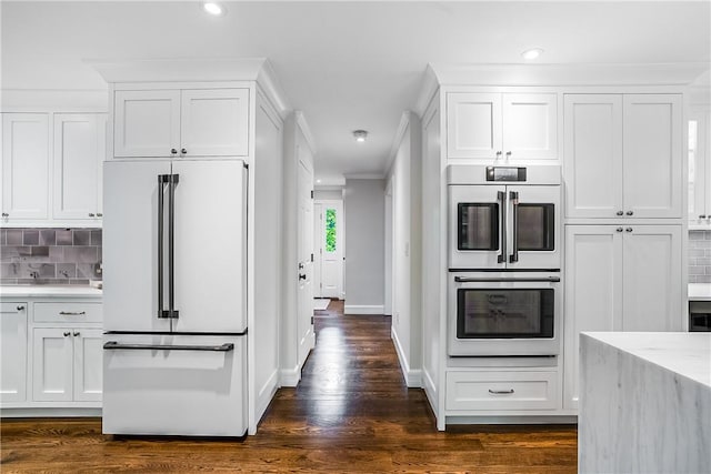 30 Hilltop Rd, Waccabuc, NY 10597 - kitchen with white appliances, white cabinetry, backsplash, recessed lighting, and light stone counters