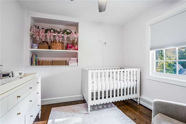 30 Hilltop Rd, Waccabuc, NY 10597 - bedroom featuring wood finished floors, a nursery area, and a ceiling fan