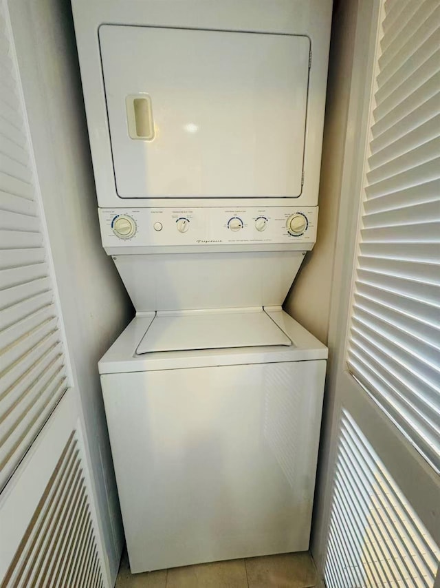 143-26 41st Ave Unit 10C, Flushing, NY 11355 - laundry room with stacked washer / drying machine and tile patterned flooring