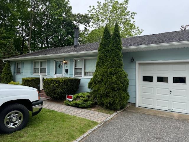 36 Hawkins Ave, Center Moriches, NY 11934 - ranch-style home with asphalt driveway, a garage, and roof with shingles