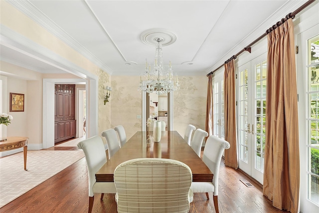 4 Pond Ln, Sands Point, NY 11050 - dining area with wood finished floors, a chandelier, french doors, and ornamental molding