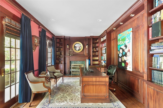 4 Pond Ln, Sands Point, NY 11050 - office area with a premium fireplace, wood finished floors, built in shelves, ornamental molding, and wooden walls