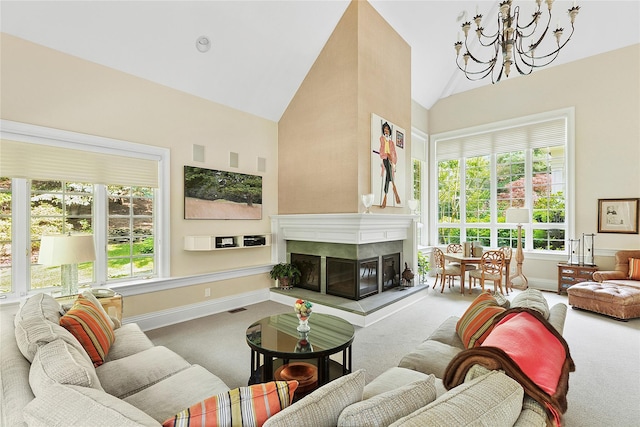 4 Pond Ln, Sands Point, NY 11050 - carpeted living room featuring a chandelier, a premium fireplace, and high vaulted ceiling