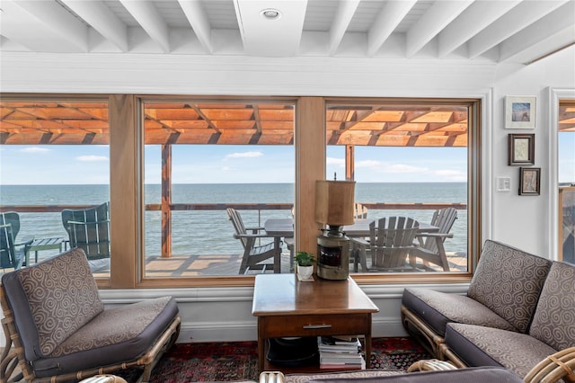 165 Bay Walk, Ocean Beach, NY 11770 - living area featuring beam ceiling, a water view, and healthy amount of natural light