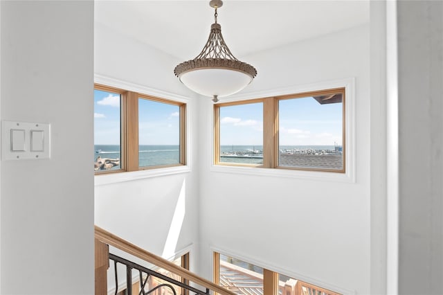 165 Bay Walk, Ocean Beach, NY 11770 - hall featuring healthy amount of natural light, a water view, and an upstairs landing
