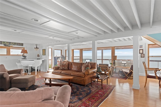 165 Bay Walk, Ocean Beach, NY 11770 - living room with light wood-style flooring, a water view, and beamed ceiling