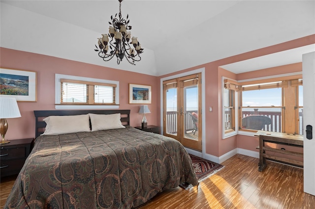 165 Bay Walk, Ocean Beach, NY 11770 - bedroom with access to outside, wood finished floors, a chandelier, lofted ceiling, and french doors