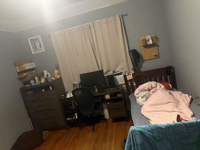 106-09 Otis Ave, Corona, NY 11368 - bedroom featuring wood finished floors and an office area