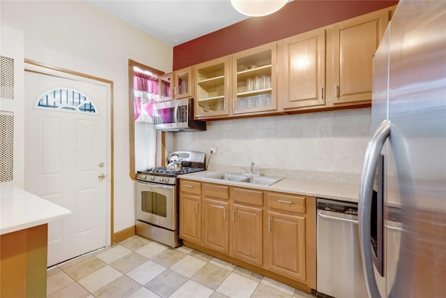 1478 Union St, Brooklyn, NY 11213 - kitchen with appliances with stainless steel finishes, backsplash, light countertops, glass insert cabinets, and light tile patterned floors