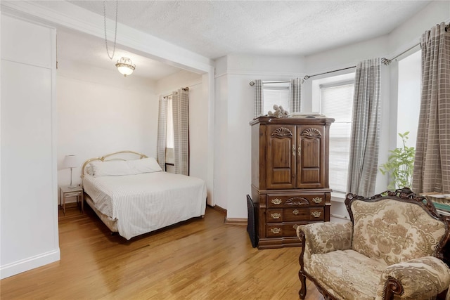 1478 Union St, Brooklyn, NY 11213 - bedroom featuring light wood finished floors and a textured ceiling